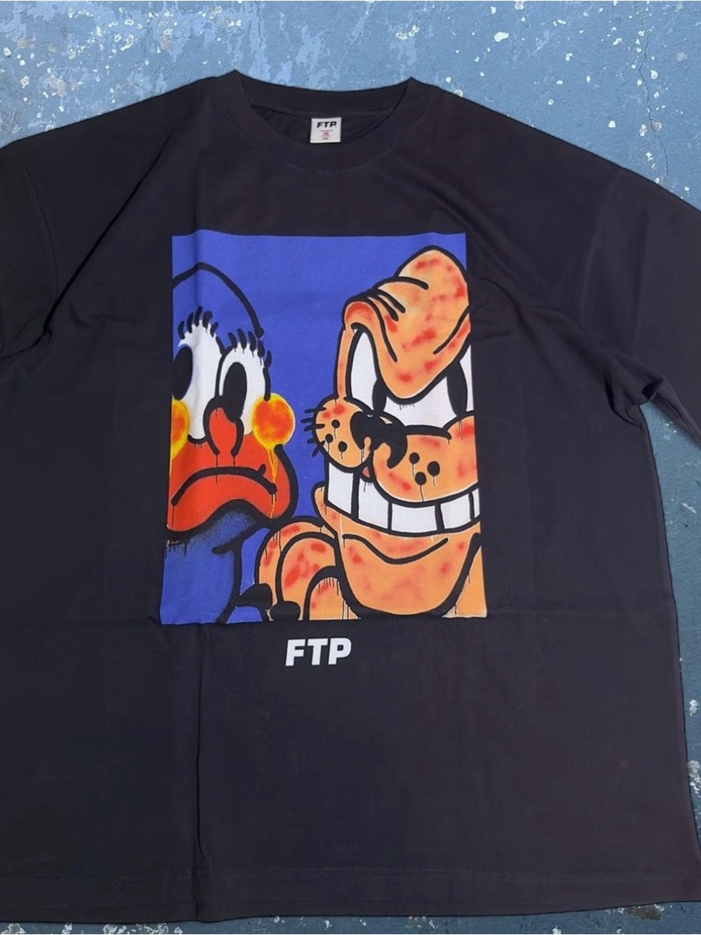 FTP Black Short Sleeve Tee with Blue, Orange and White Cartoon Panel